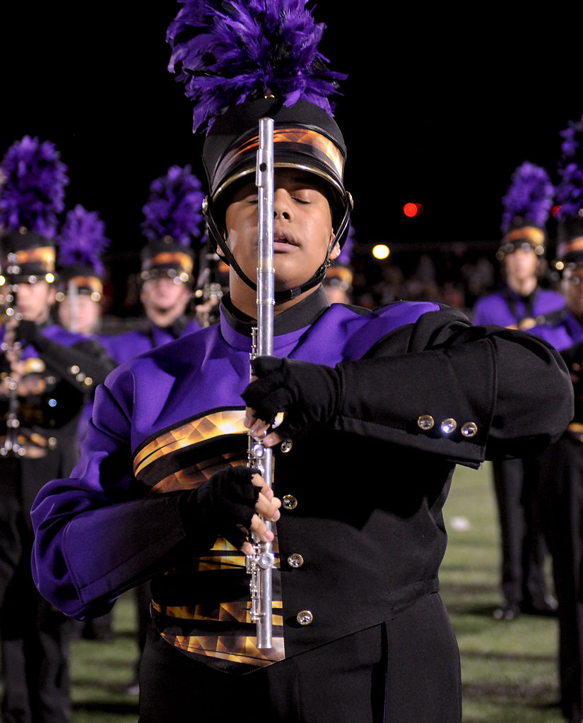 Malcolm Moody holds his flute while closing his eyes